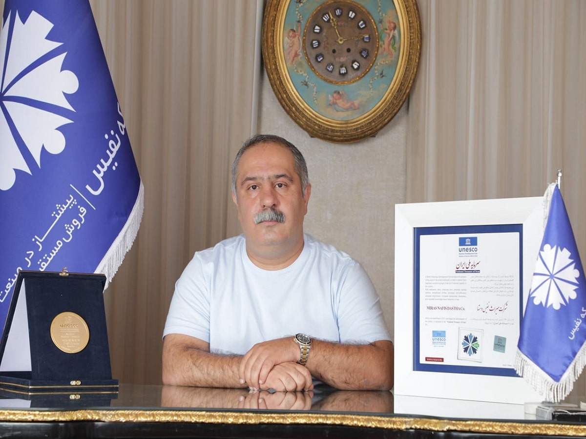 Peyman Kianian seated at his desk
